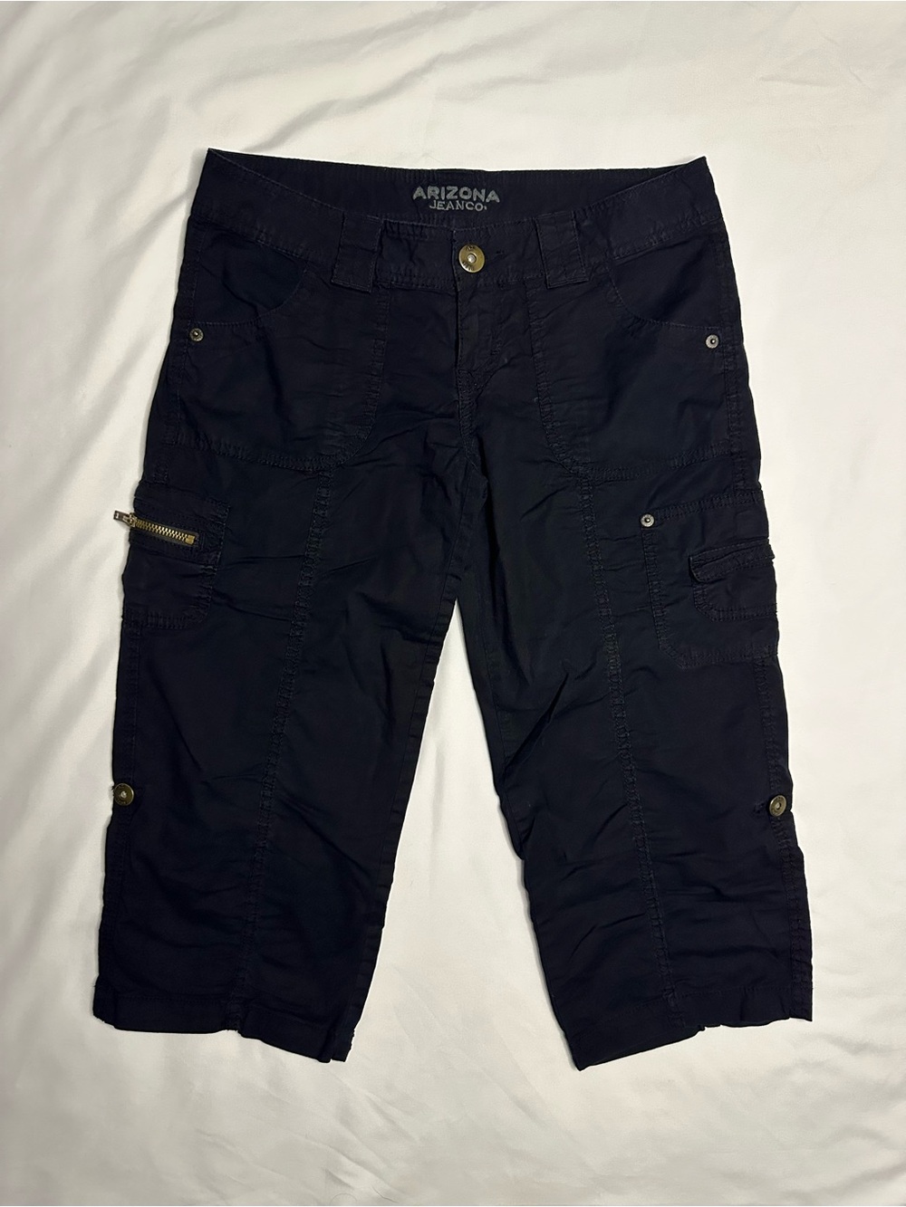 Arizona Jean Co. black low rise capris with zipper pocket and roll up detail